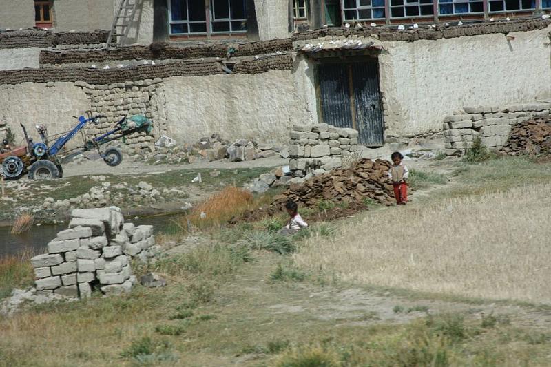 157 Children entertain themselves while adults harvest.jpg